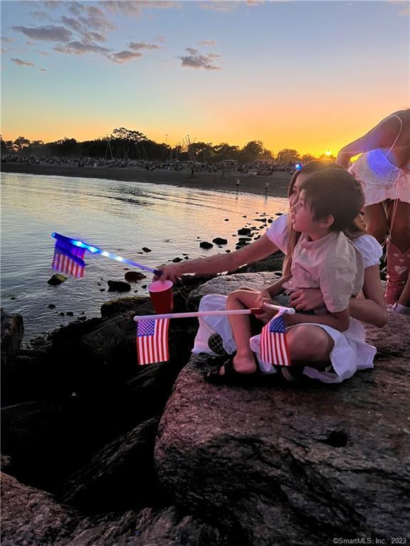 331 Riverside Drive Fairfield, CT 06824 - Photo 31 of 34 a view of a lake with a mountain in the background