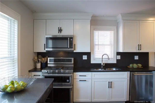 a kitchen with a stove and a microwave