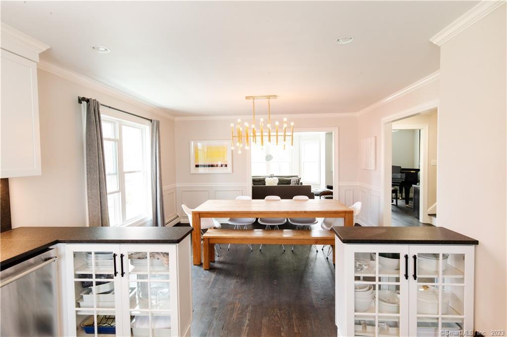 331 Riverside Drive Fairfield, CT 06824 - Photo 6 of 34 a view of a dining room with furniture and wooden floor