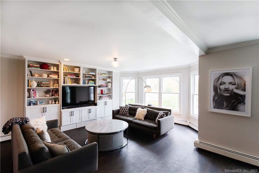 331 Riverside Drive Fairfield, CT 06824 - Photo 10 of 34 a living room with furniture and a flat screen tv