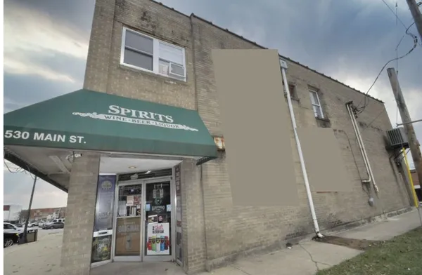 a kitchen with granite countertop white cabinets and black appliances