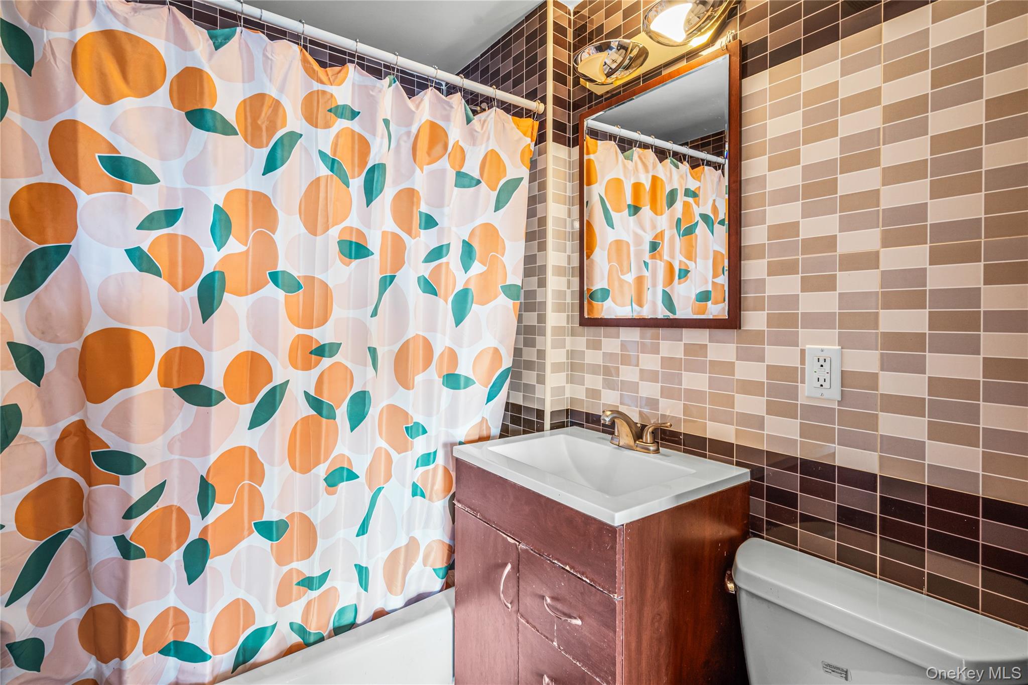37-17 111th Street, Unit 4F Queens, NY 11368 - Photo 13 of 19 a bathroom with a sink and a stove