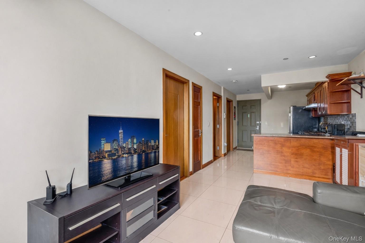 37-17 111th Street, Unit 4F Queens, NY 11368 - Photo 4 of 19 a open kitchen with stainless steel appliances granite countertop a refrigerator and a stove top oven