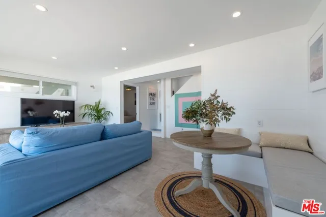 a bathroom with granite countertop a sink a toilet and shower