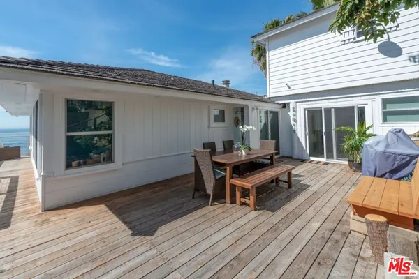 a view of a house with wooden floor and chair