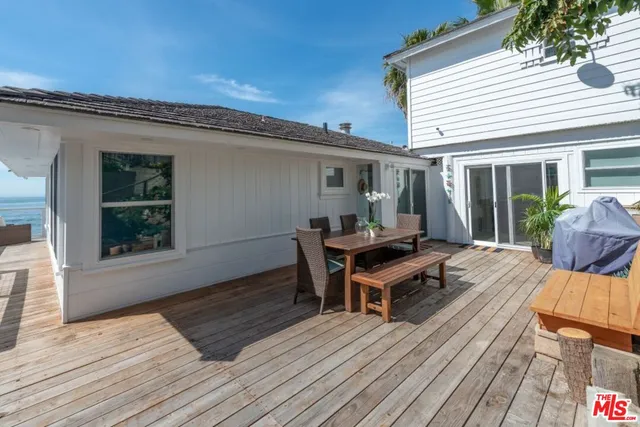 a view of a house with wooden floor and chair