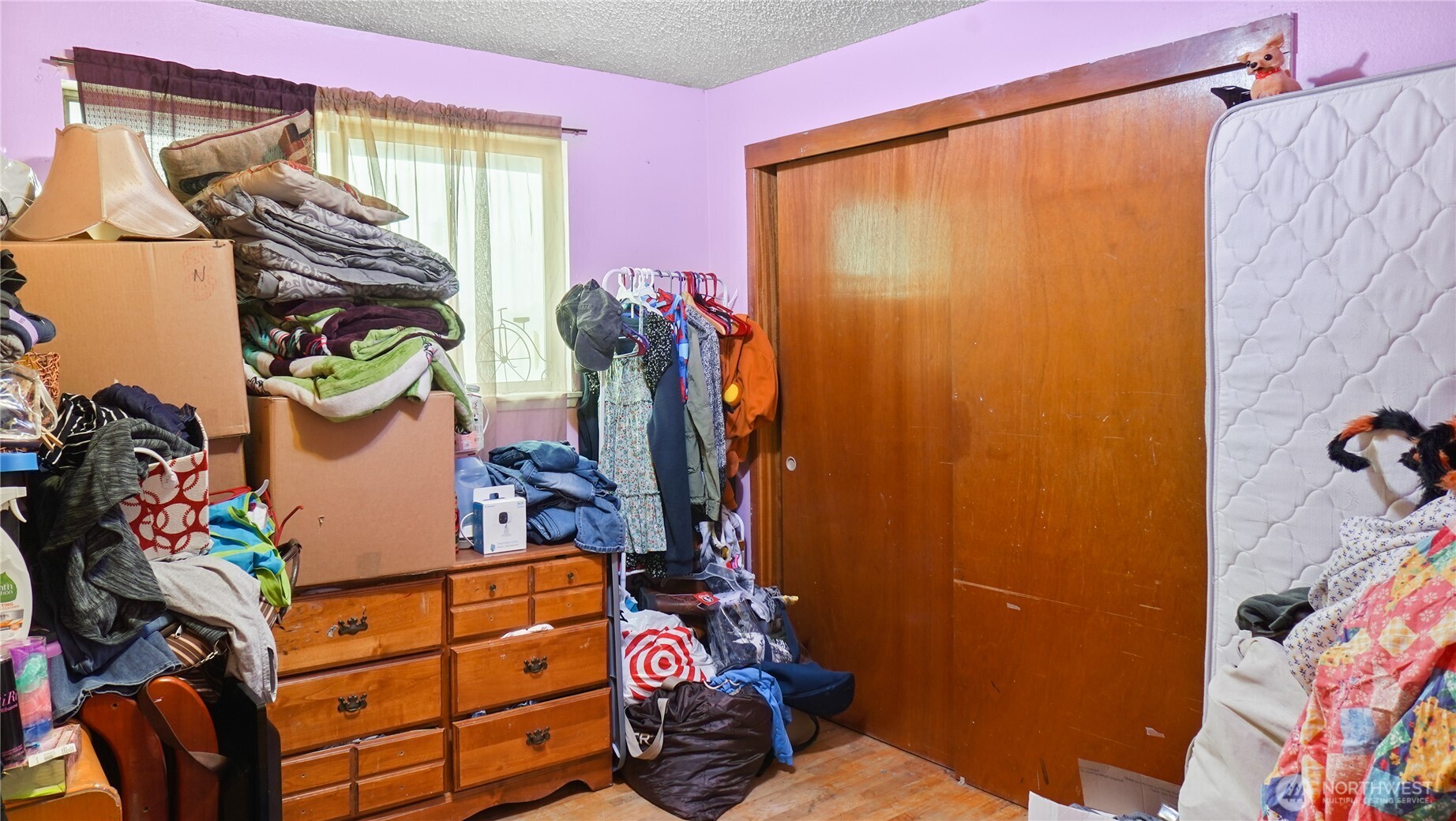 224 Calla Loop Northwest Royal City, WA 99357 - Photo 14 of 28 a view of walk in closet with clothes and shoes