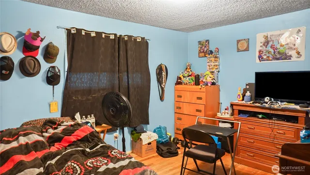 a bedroom with a bed and furniture