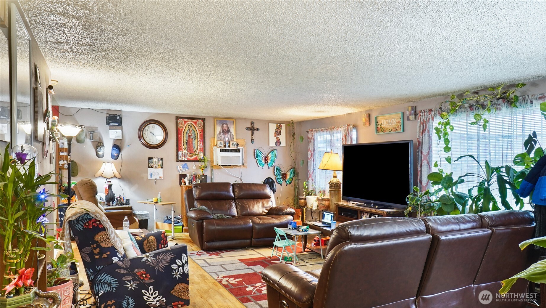 224 Calla Loop Northwest Royal City, WA 99357 - Photo 19 of 28 a living room with furniture and a flat screen tv