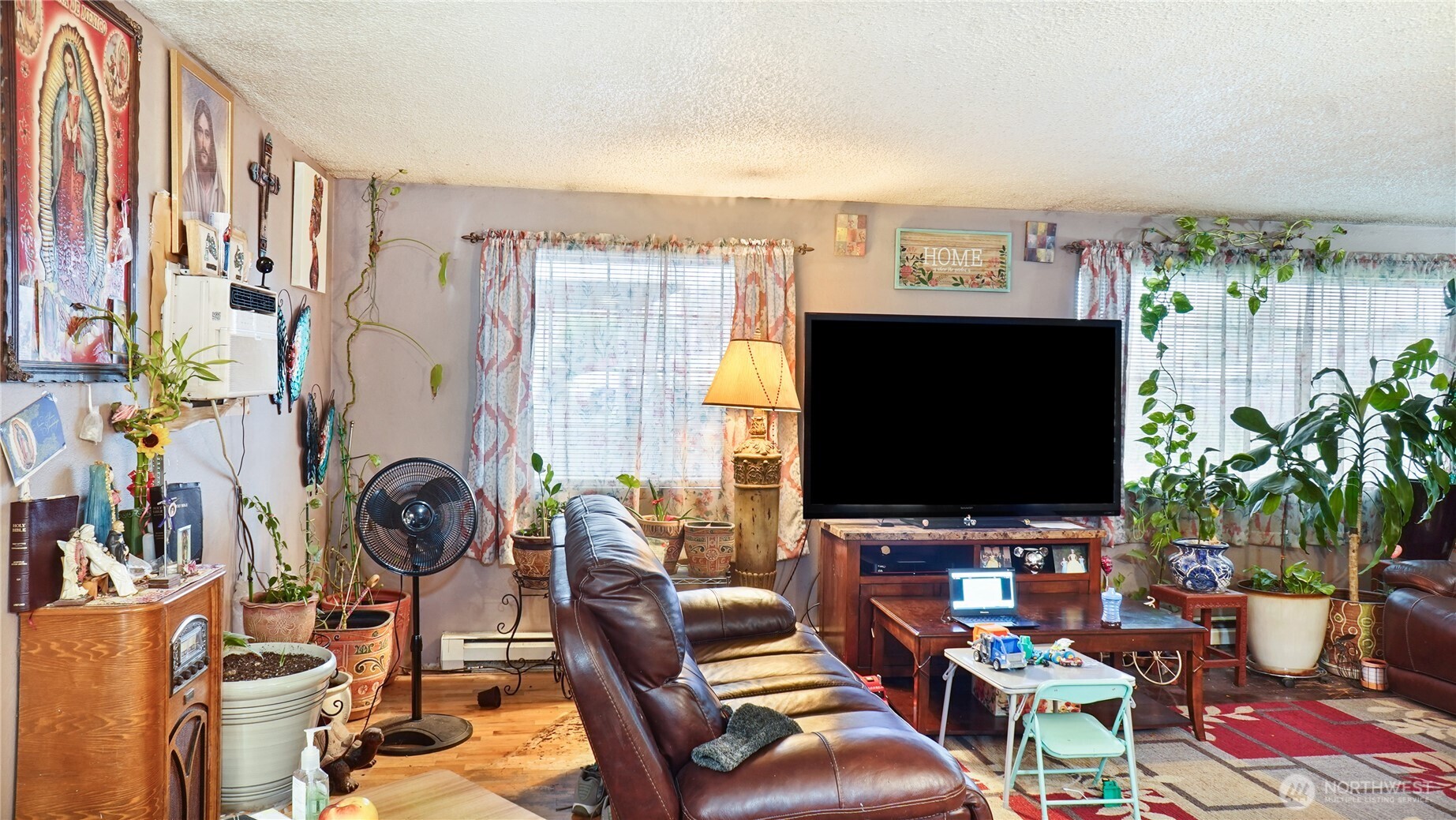 224 Calla Loop Northwest Royal City, WA 99357 - Photo 21 of 28 a living room with furniture and a flat screen tv