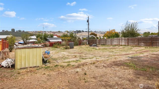 a view of a lake with a yard and mountain view