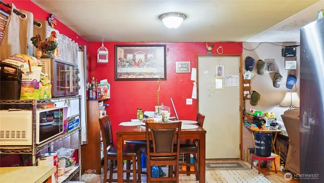 a view of a dining room with furniture and chandelier