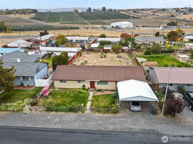 an aerial view of residential houses and outdoor space