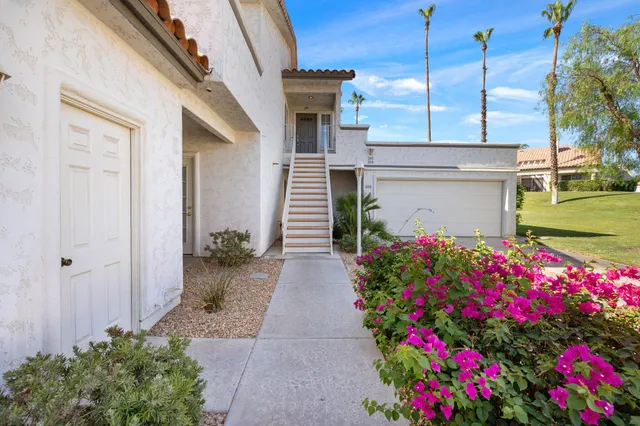 a kitchen with kitchen island white cabinets and sink