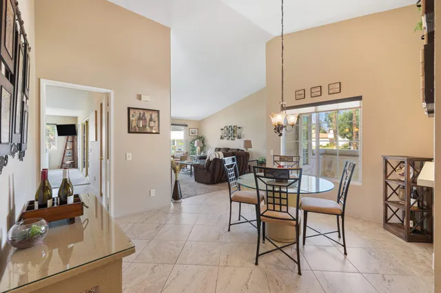 a kitchen with granite countertop a sink and a stove top oven