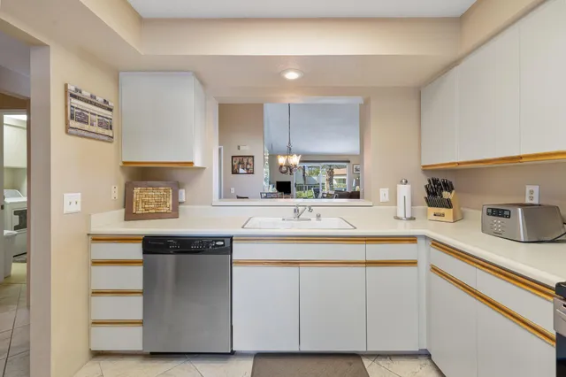 a view of a chairs and table in the balcony