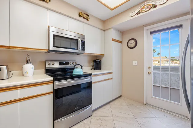 a view of a balcony with chairs