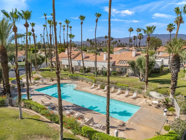 a view of a swimming pool with a lake view