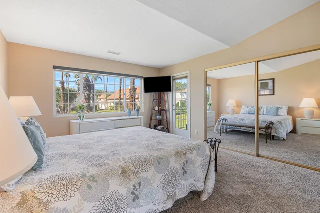 a bedroom with a bed and chair