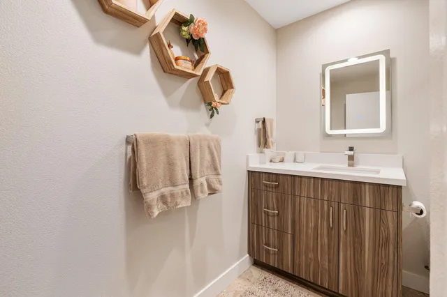 a living room with furniture a rug and a large window