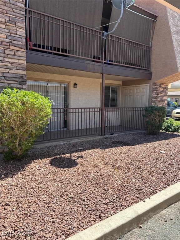 5021 River Glen Drive, Unit 41 Las Vegas, NV 89103 - Photo 3 of 12 View of exterior entry with stucco siding, a balco