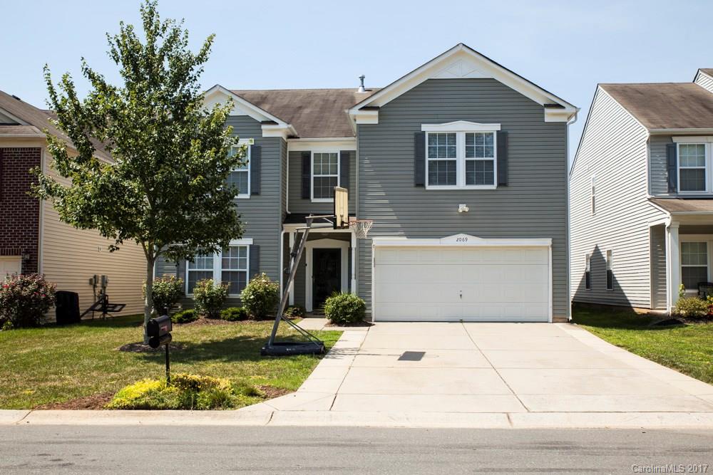 2069 Durand Road Fort Mill, SC 29715 - Photo 1 of 23 a front view of a house with garden