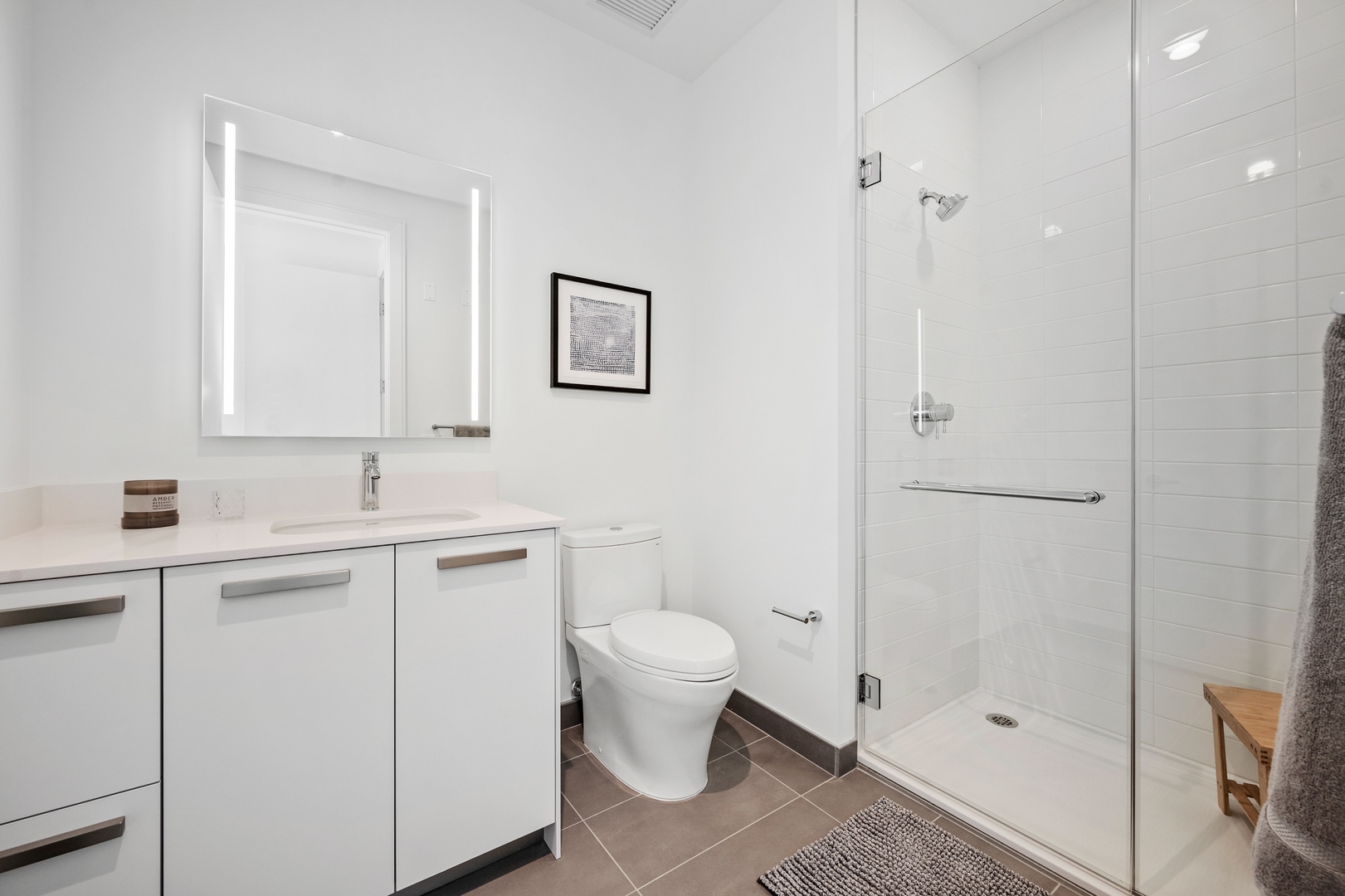 60 East Randolph Street, Unit 23B Chicago, IL 60601 - Photo 12 of 27 a bathroom with a sink toilet and shower