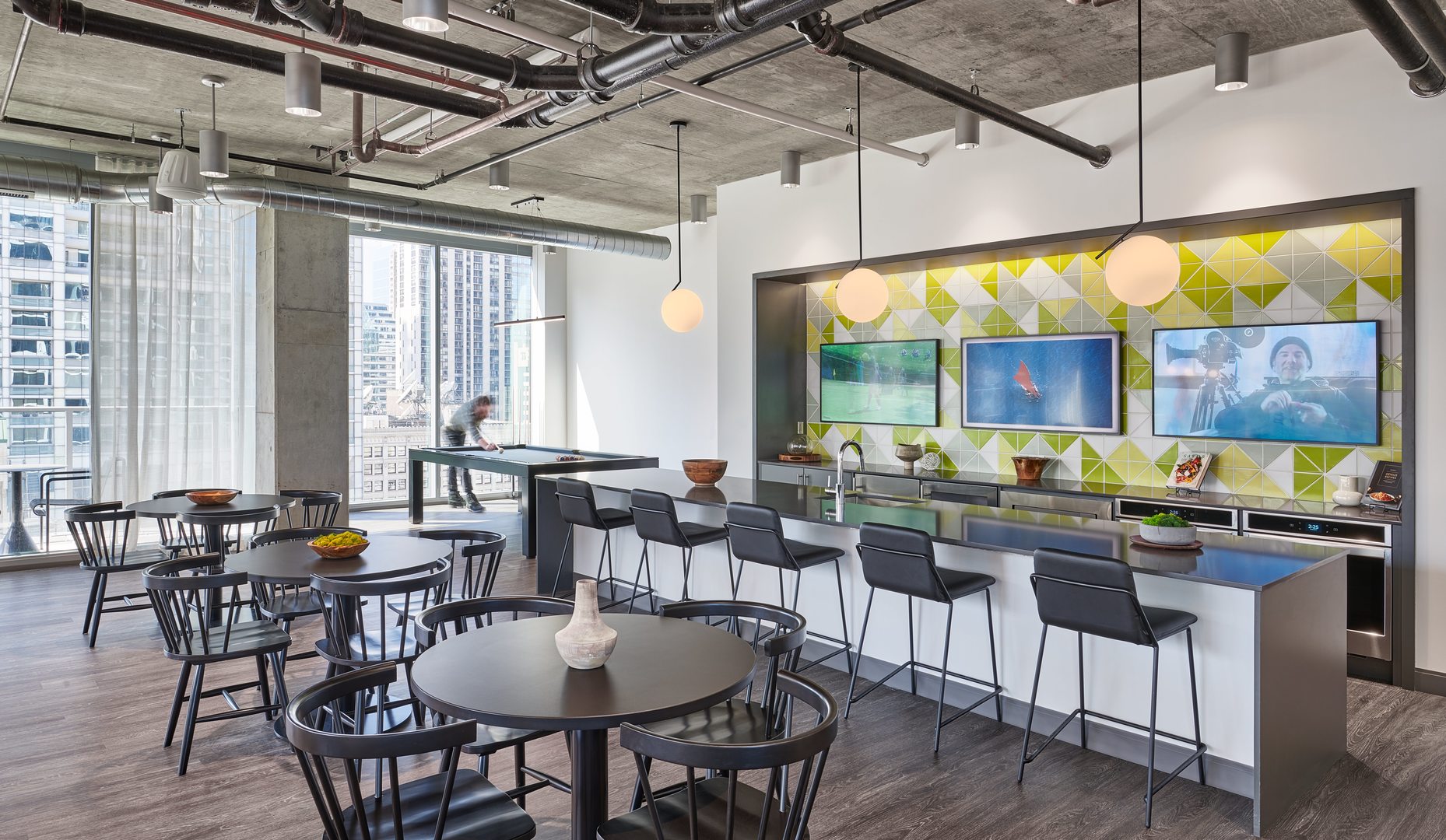 60 East Randolph Street, Unit 23B Chicago, IL 60601 - Photo 22 of 27 a room with lots of wooden furniture and a large window