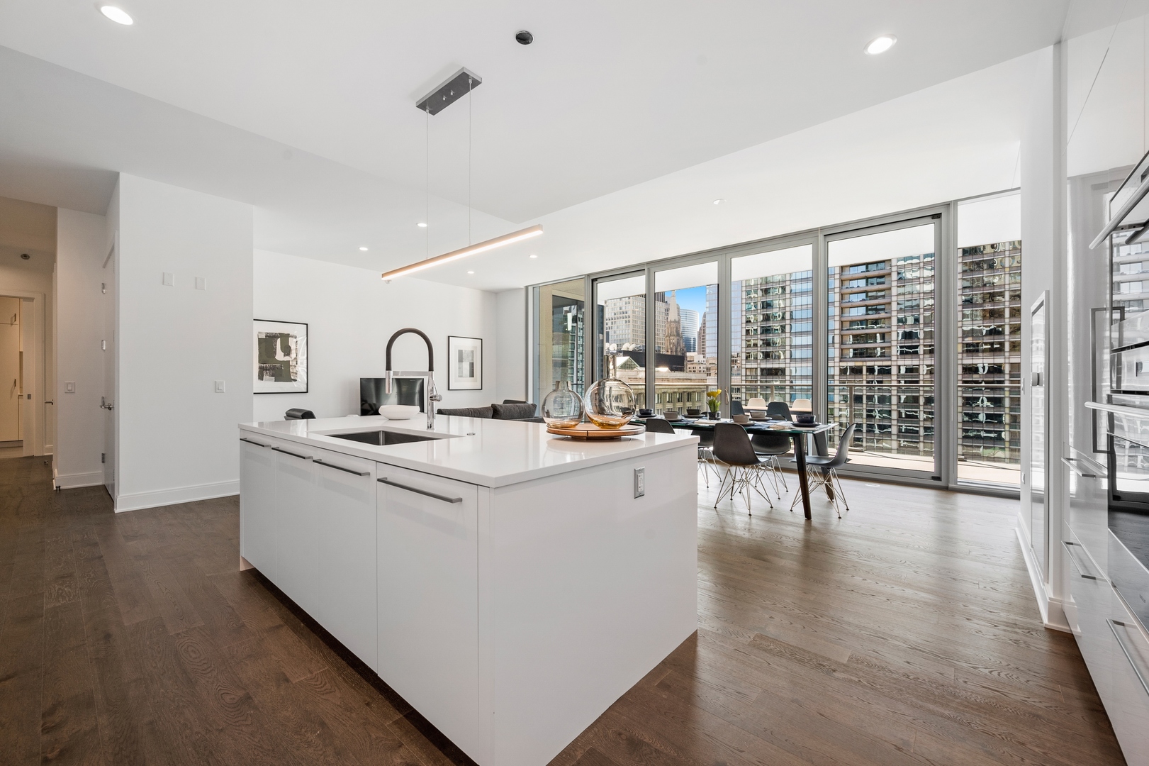 60 East Randolph Street, Unit 23B Chicago, IL 60601 - Photo 8 of 27 a living room with furniture a rug and white walls