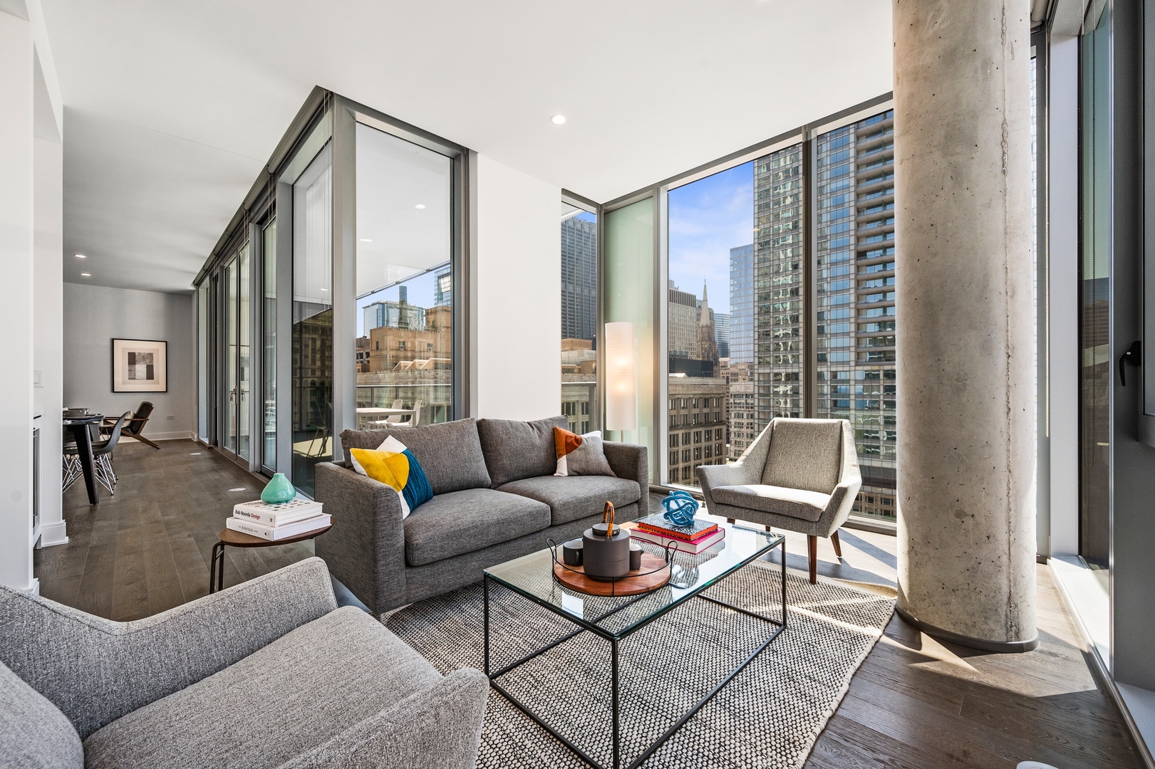 60 East Randolph Street, Unit 23B Chicago, IL 60601 - Photo 10 of 27 a living room with furniture and a floor to ceiling window