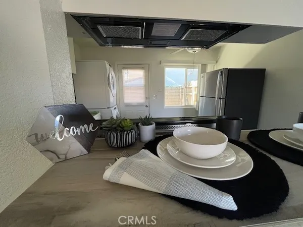 a kitchen with a stove and a refrigerator