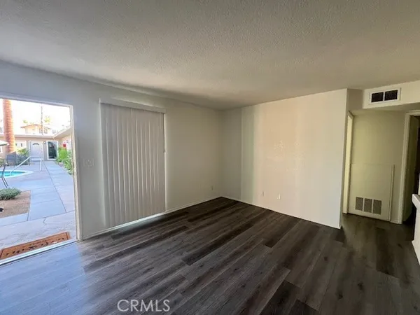a view of a kitchen cabinets and wooden floor