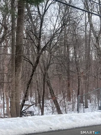 a view of a backyard of the house