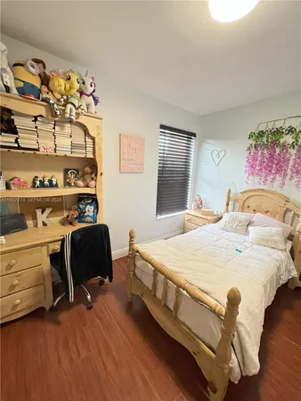 a bedroom with a bed and a chair