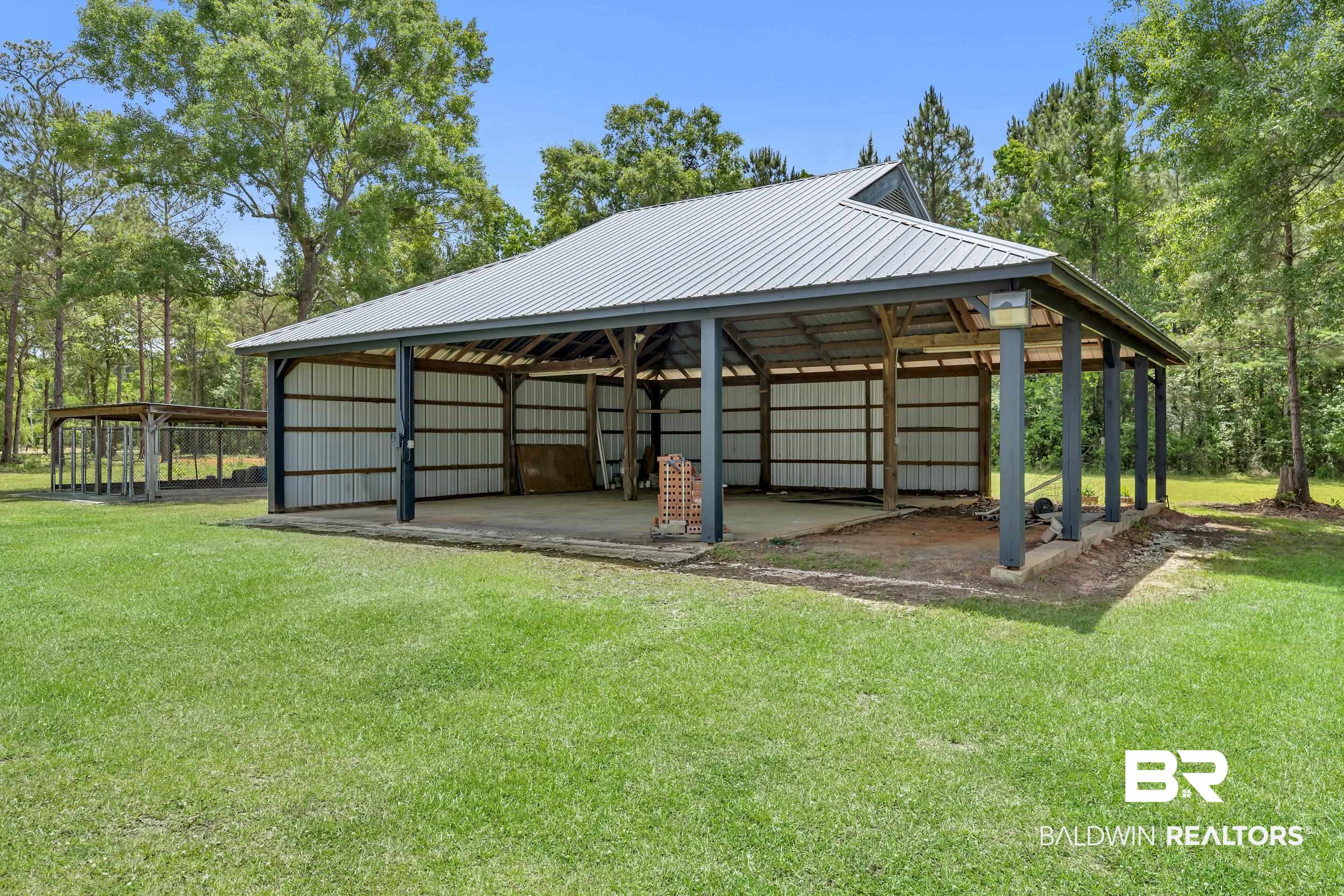 43199 Pine Grove Road Bay Minette, AL 36507 - Photo 15 of 71 Large open-air structure featuring a metal roof and concrete slab