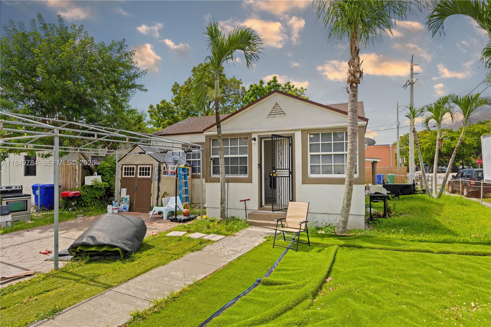 a view of a house with backyard porch and sitting area