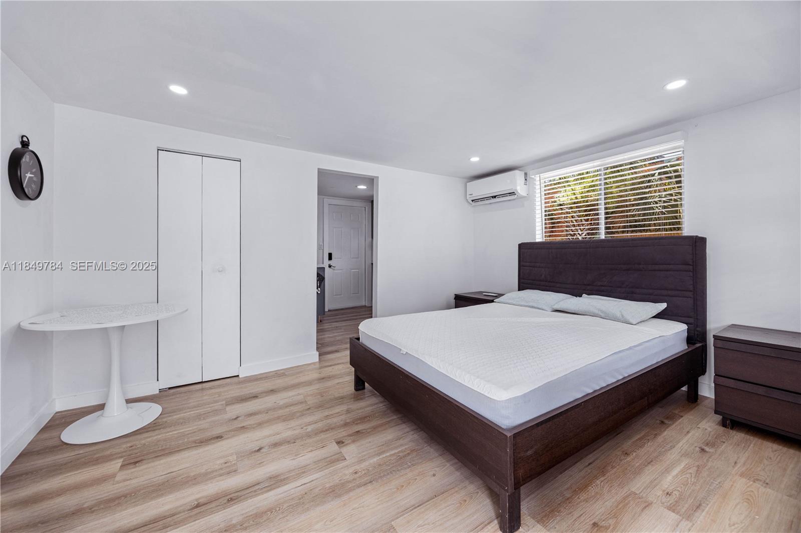 790 Northwest 63rd Street Miami, FL 33150 - Photo 15 of 35 a bedroom with a bed and a table