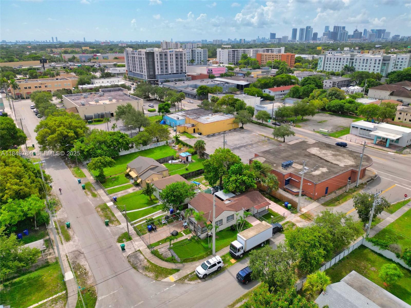 790 Northwest 63rd Street Miami, FL 33150 - Photo 26 of 35 an aerial view of residential houses with outdoor space and swimming pool