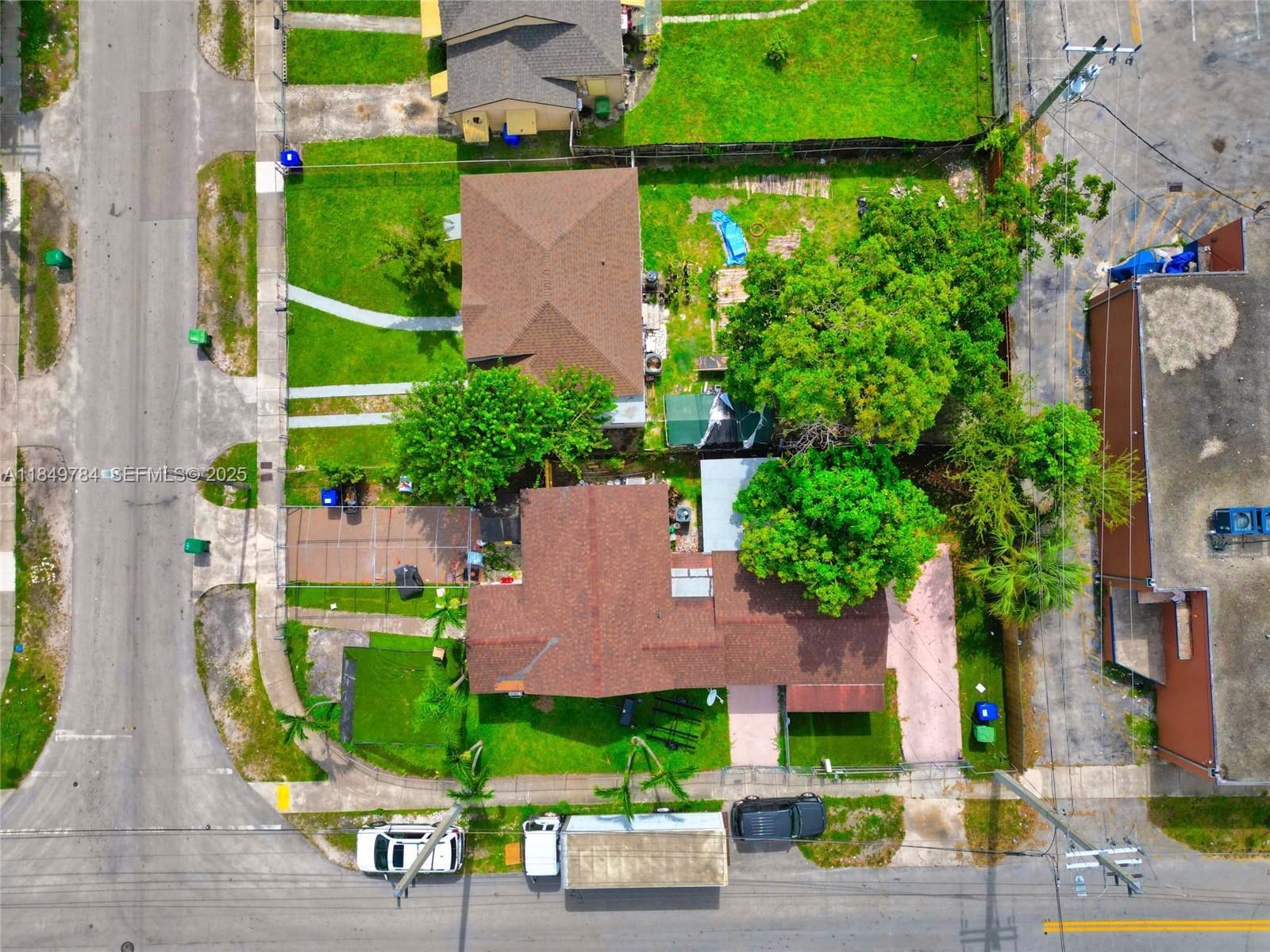 790 Northwest 63rd Street Miami, FL 33150 - Photo 33 of 35 an aerial view of a house with garden space and street view