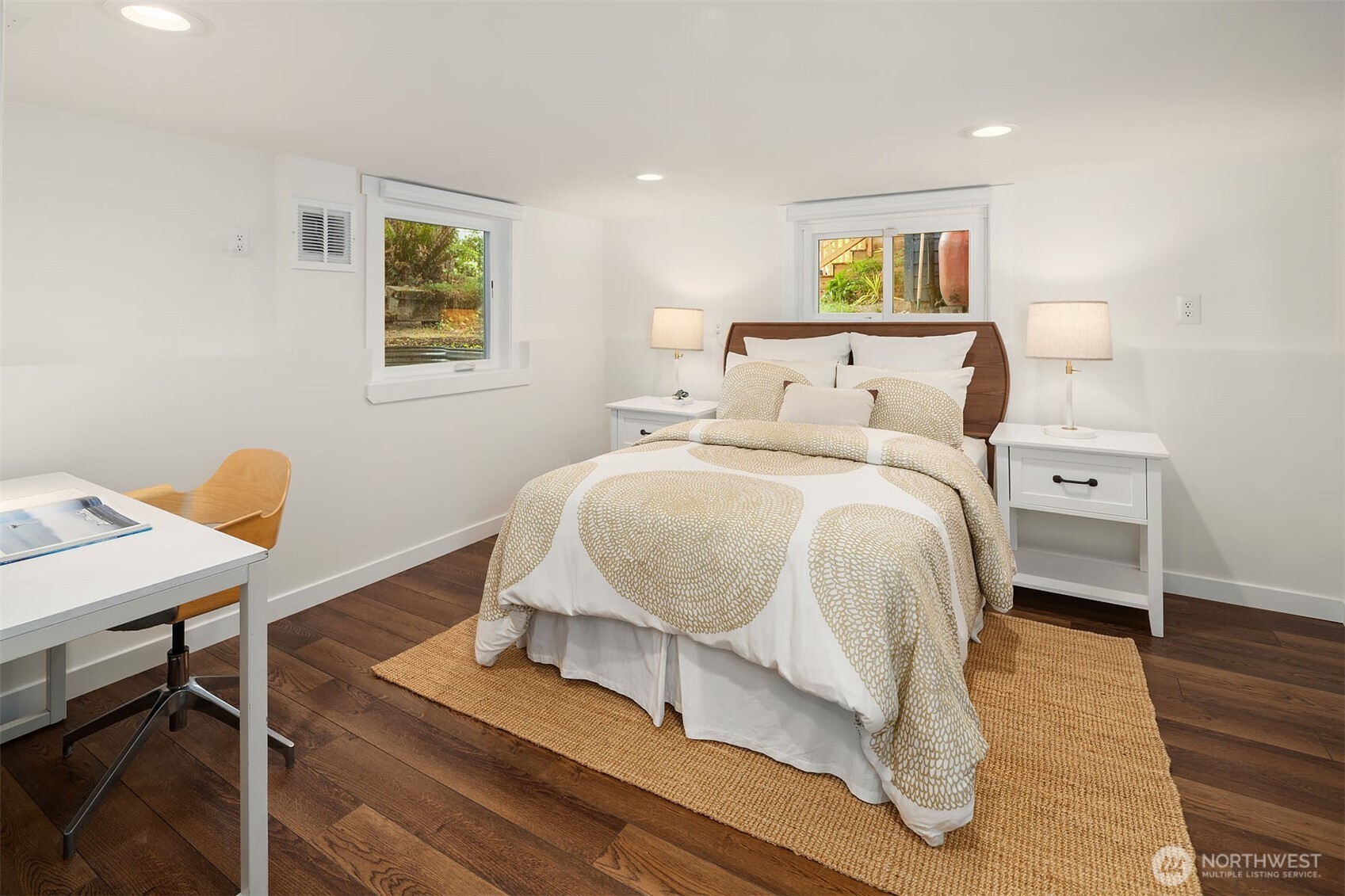519 27th Avenue Seattle, WA 98122 - Photo 22 of 38 a bedroom with a bed and paintings on the wall