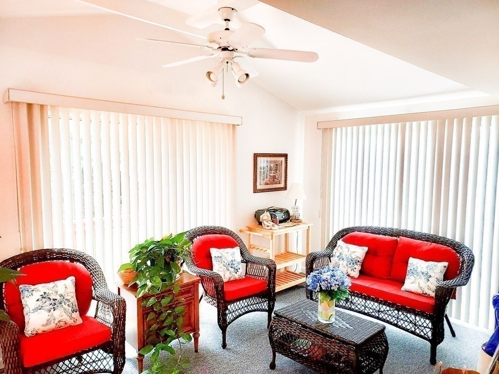 37 Heritage Road Billerica, MA 01821 - Photo 11 of 24 a living room with furniture and a chandelier