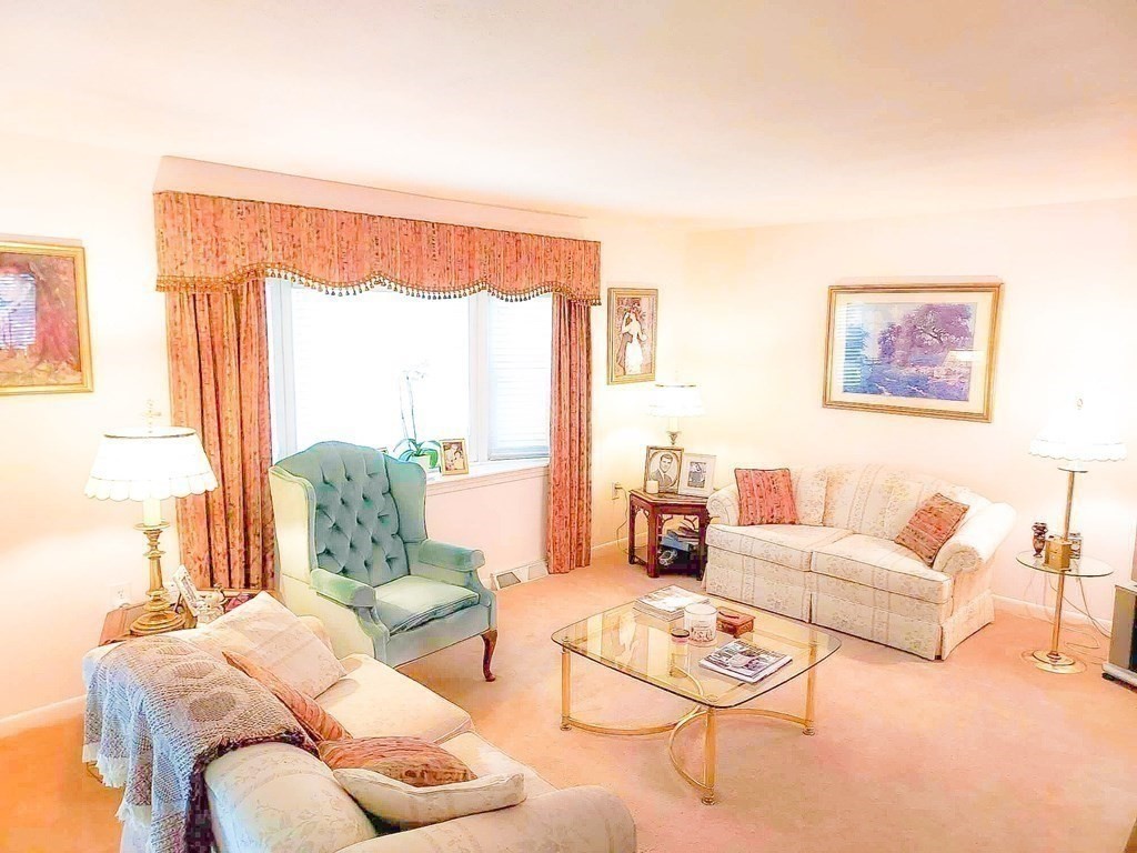 37 Heritage Road Billerica, MA 01821 - Photo 14 of 24 a living room with furniture and a large window