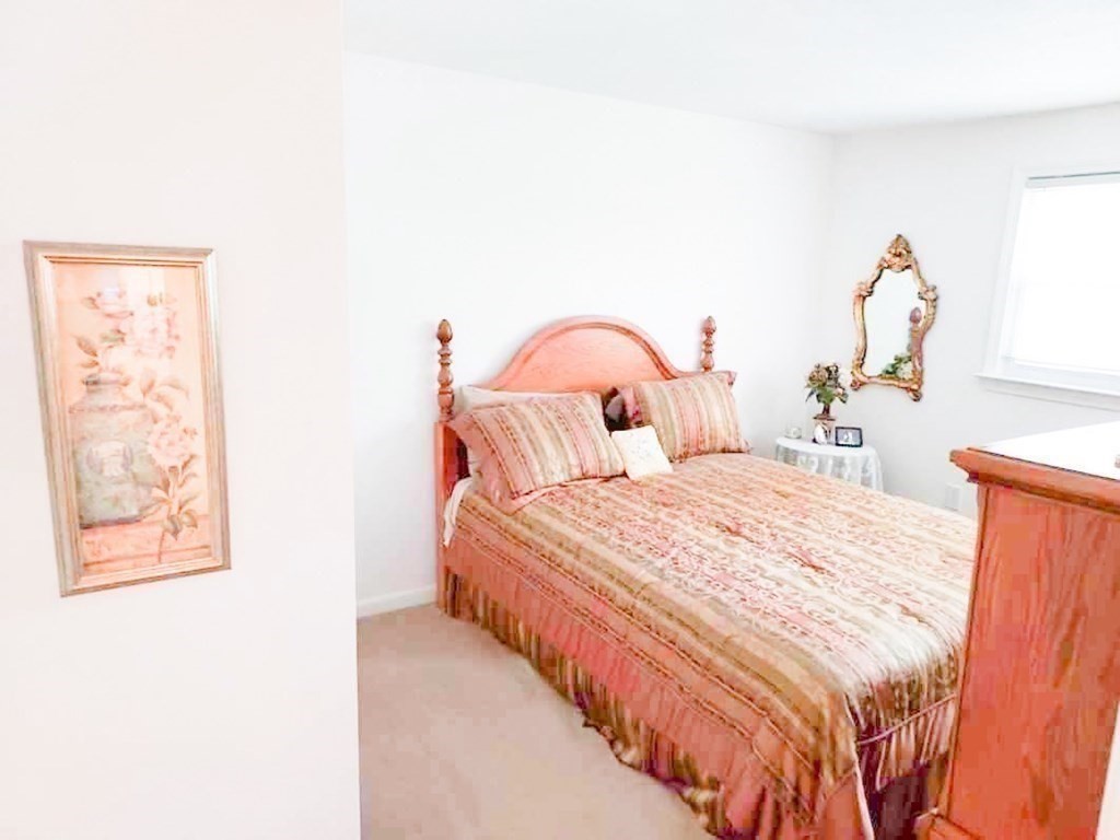 37 Heritage Road Billerica, MA 01821 - Photo 18 of 24 a bedroom with bed and a painting