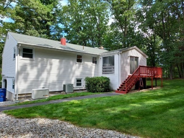37 Heritage Road Billerica, MA 01821 - Photo 6 of 24 a front view of a house with a yard and garage