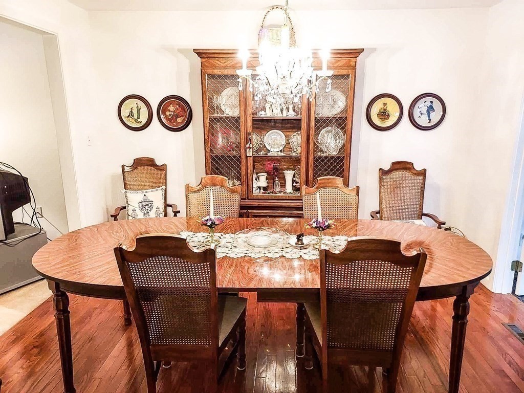 37 Heritage Road Billerica, MA 01821 - Photo 10 of 24 a table and chairs in a dining room
