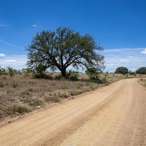 a view of a lake with a yard
