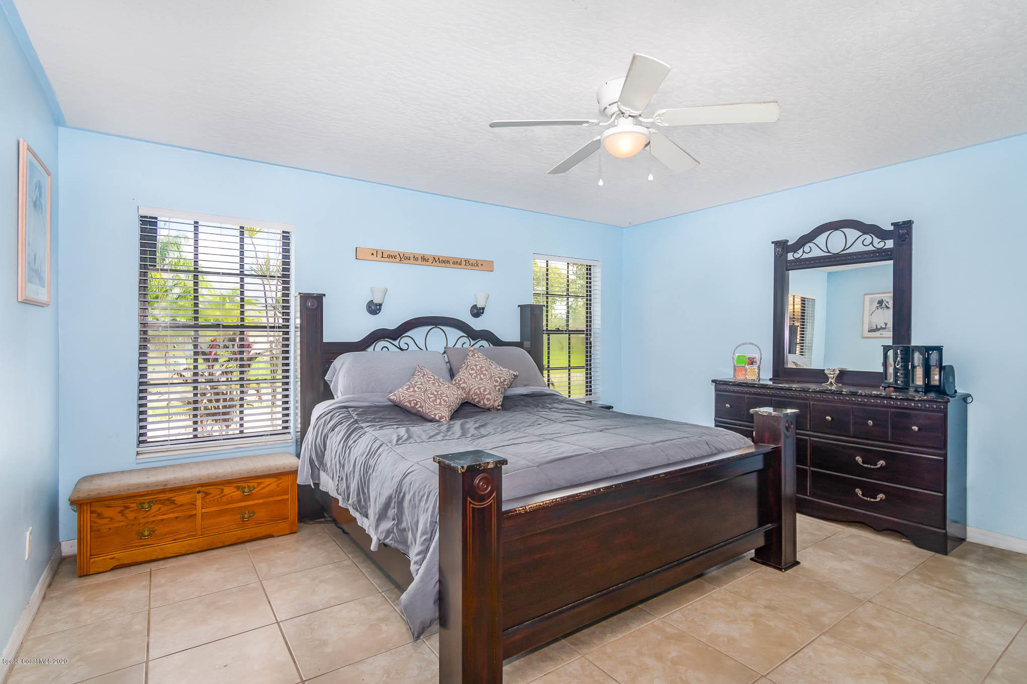 484 Rheine Road Northwest Palm Bay, FL 32907 - Photo 12 of 24 a bedroom with a bed and a dresser