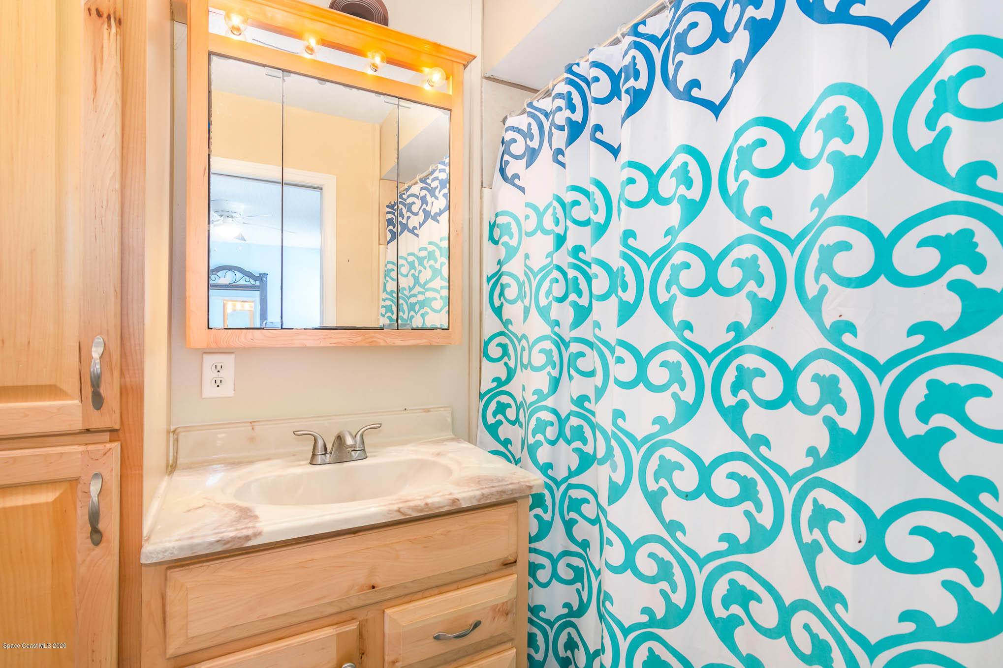 484 Rheine Road Northwest Palm Bay, FL 32907 - Photo 14 of 24 a bathroom with a sink and a granite countertop