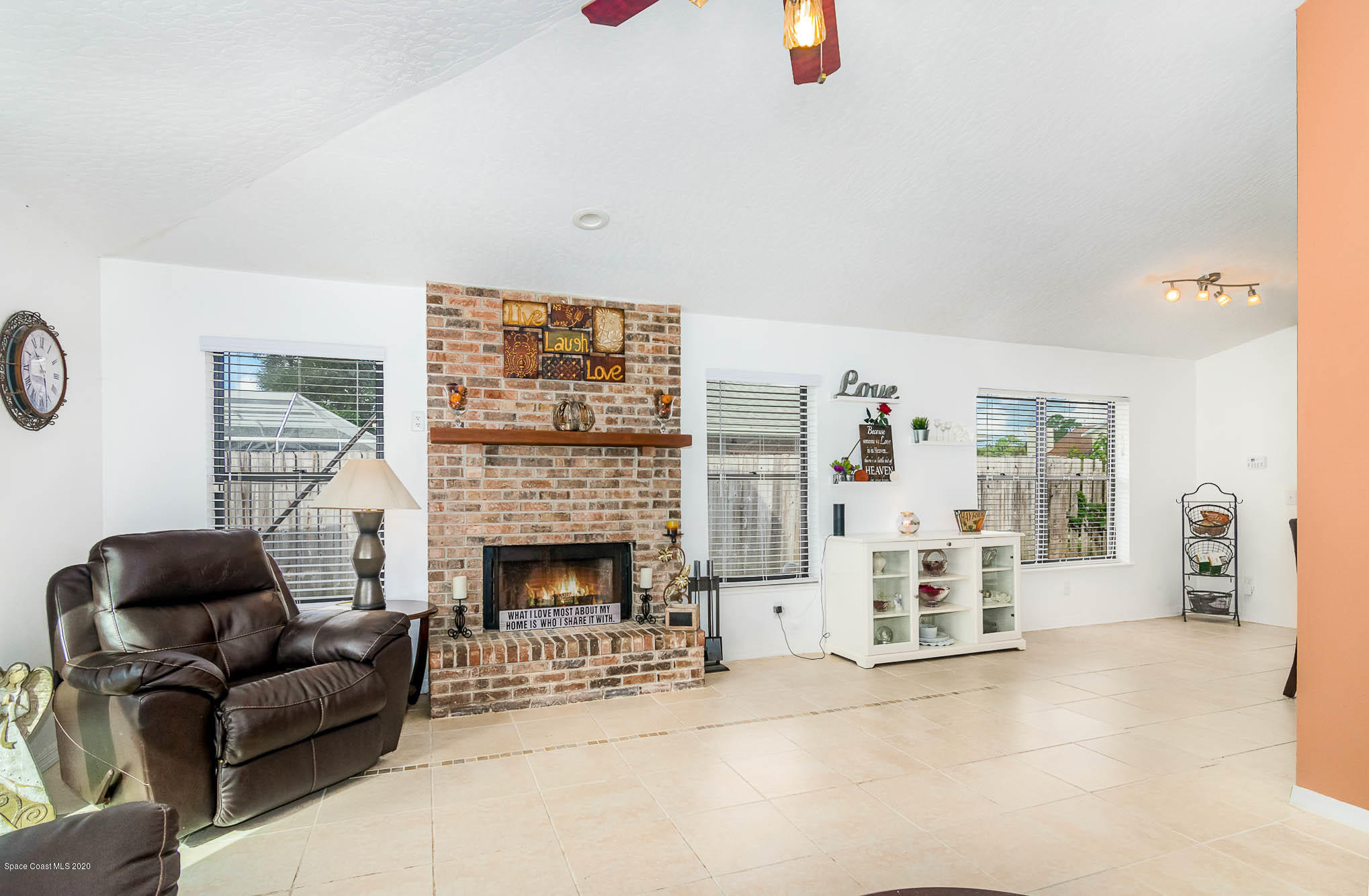484 Rheine Road Northwest Palm Bay, FL 32907 - Photo 4 of 24 a living room with furniture and a fireplace