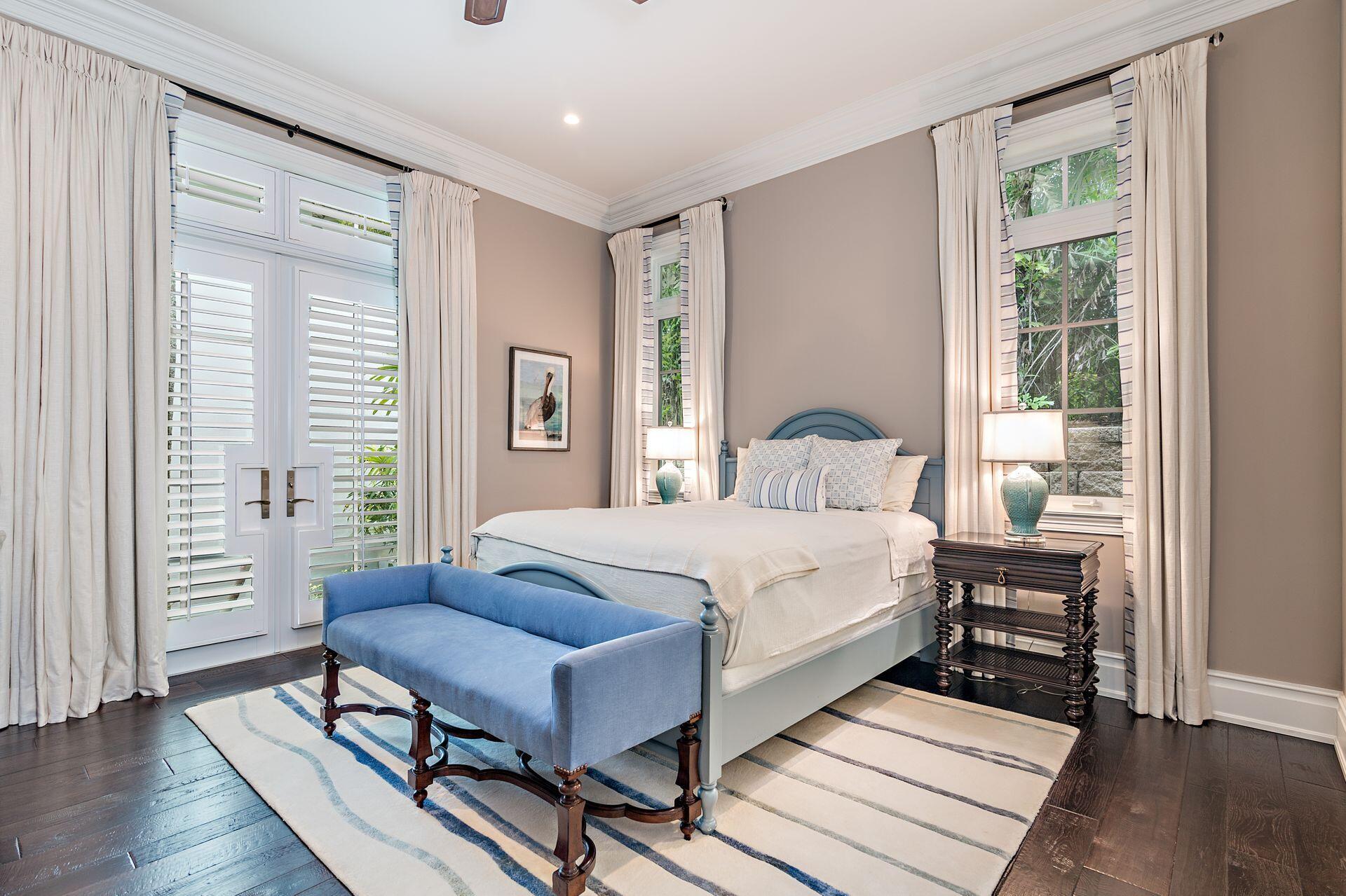 1222 North Ocean Boulevard Gulf Stream, FL 33483 - Photo 16 of 61 a bedroom with a bed and wooden floor